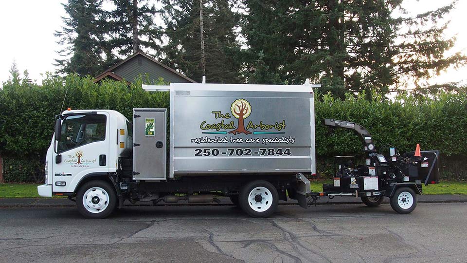 Box truck with chipper parked on quiet Comox Valley street